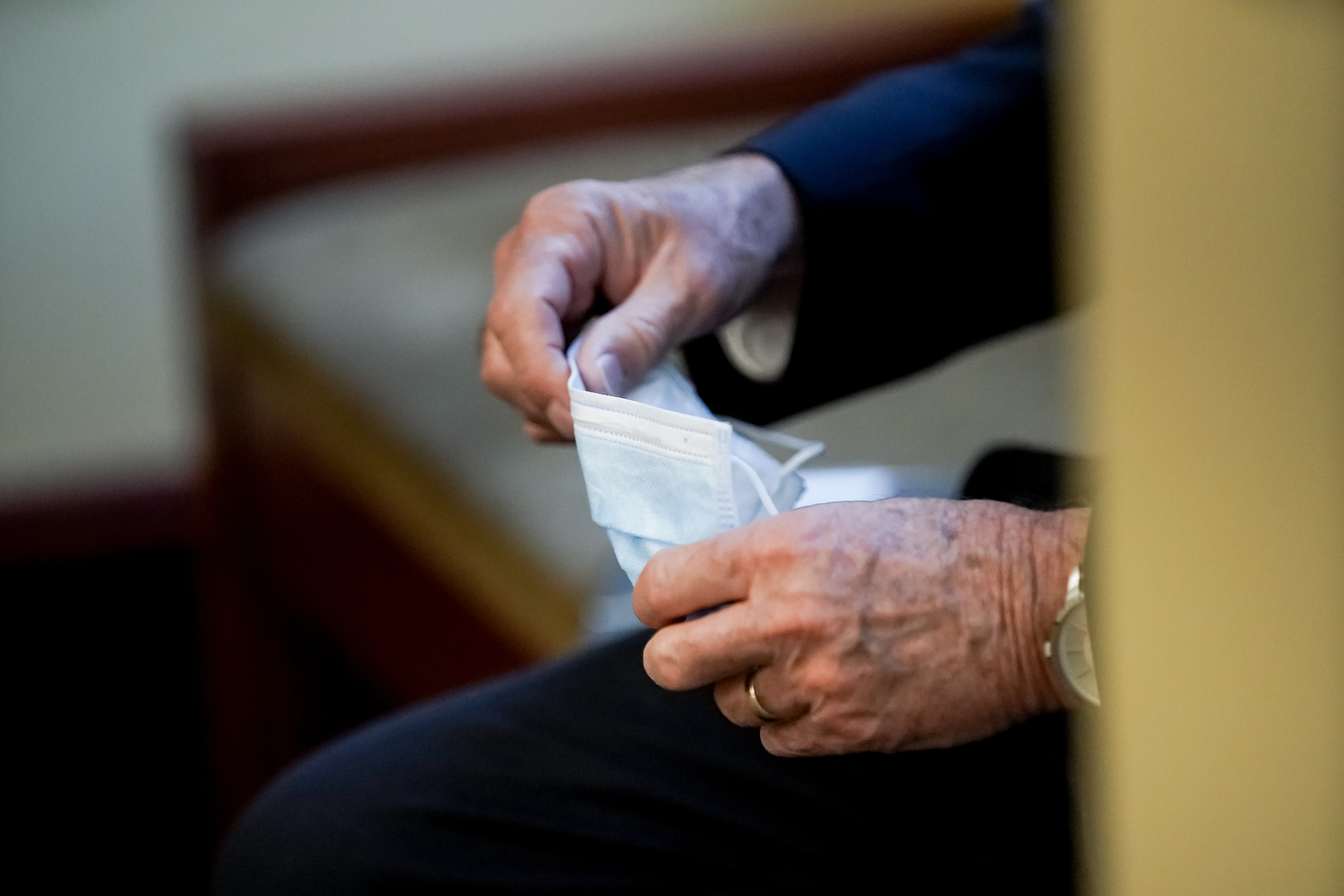 Gov. Gary Herbert holds a surgical mask after speaking during a press briefing at the Capitol in Salt Lake City on Wednesday, July 22, 2020.