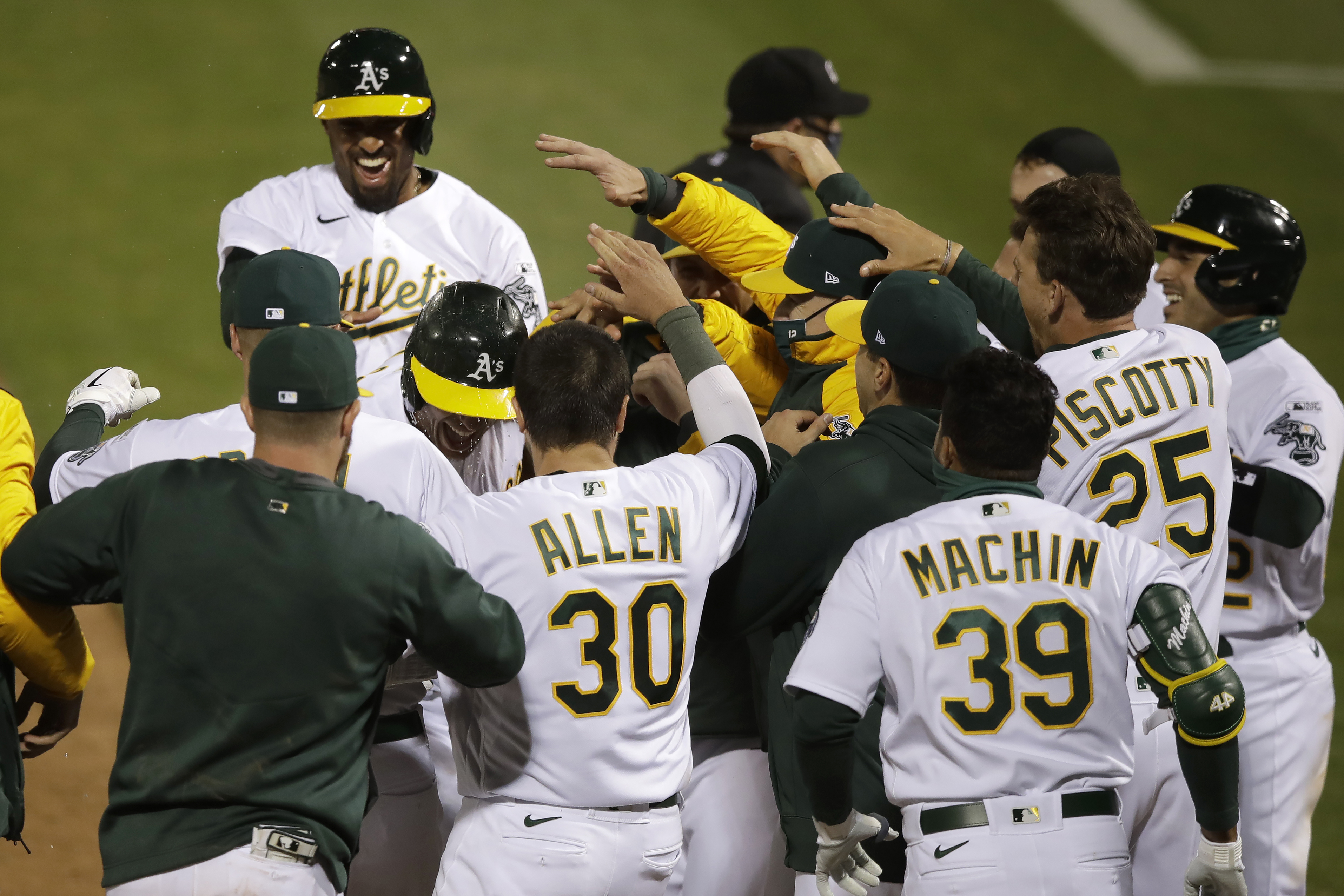 In 1st MLB game with new extra-inning rule, A's slam Angels