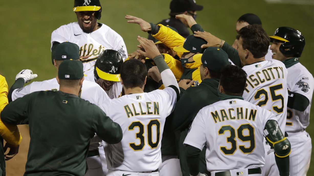 In 1st MLB game with new extra-inning rule, A's slam Angels