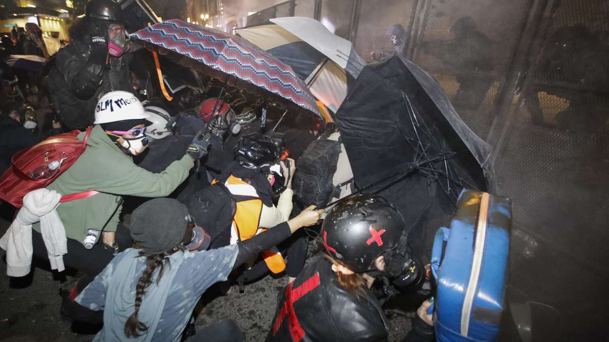 Portland protesters breach fence around federal courthouse
