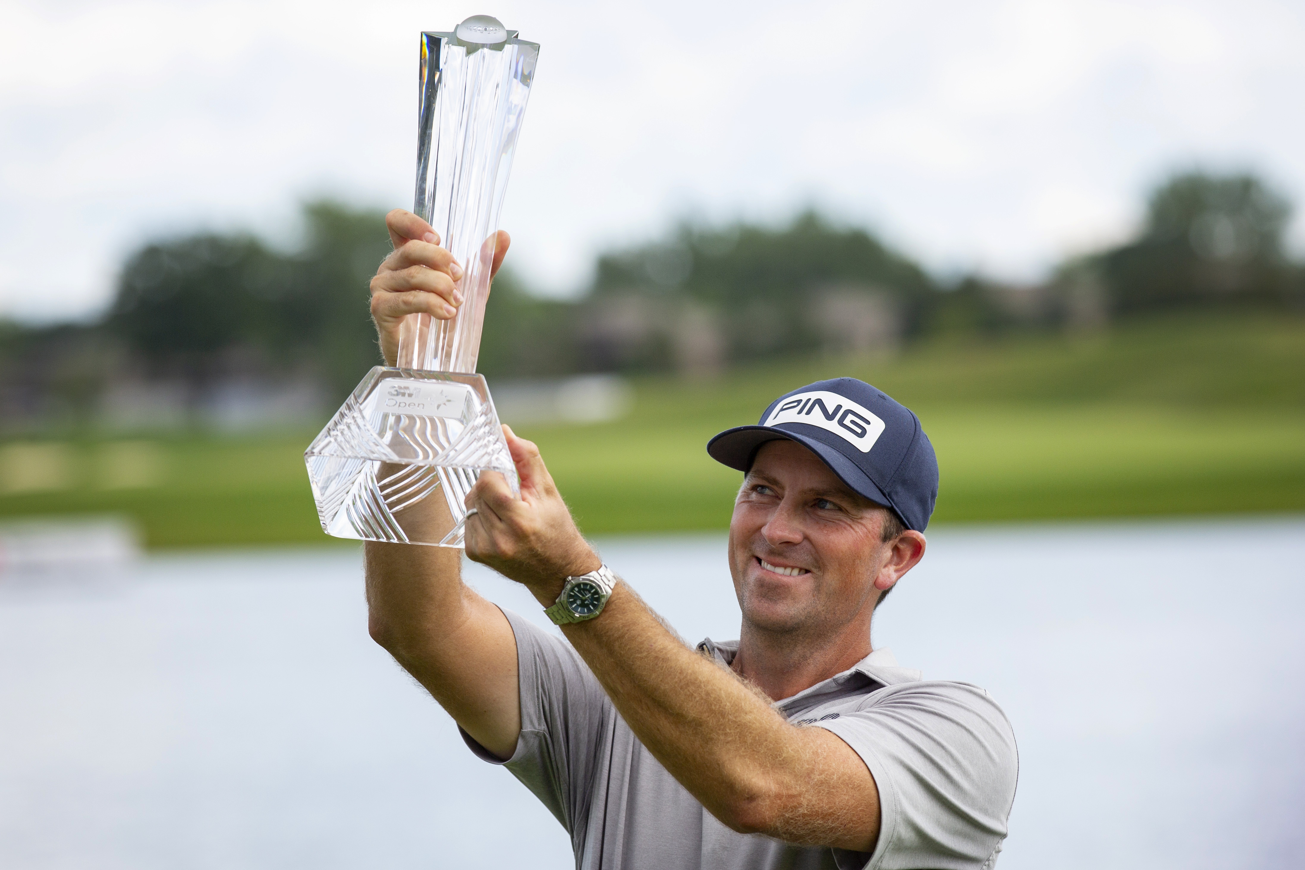 Michael Thompson holds the trophy after winning the 3M Open golf tournament in Blaine, Minn., Sunday, July 26, 2020.