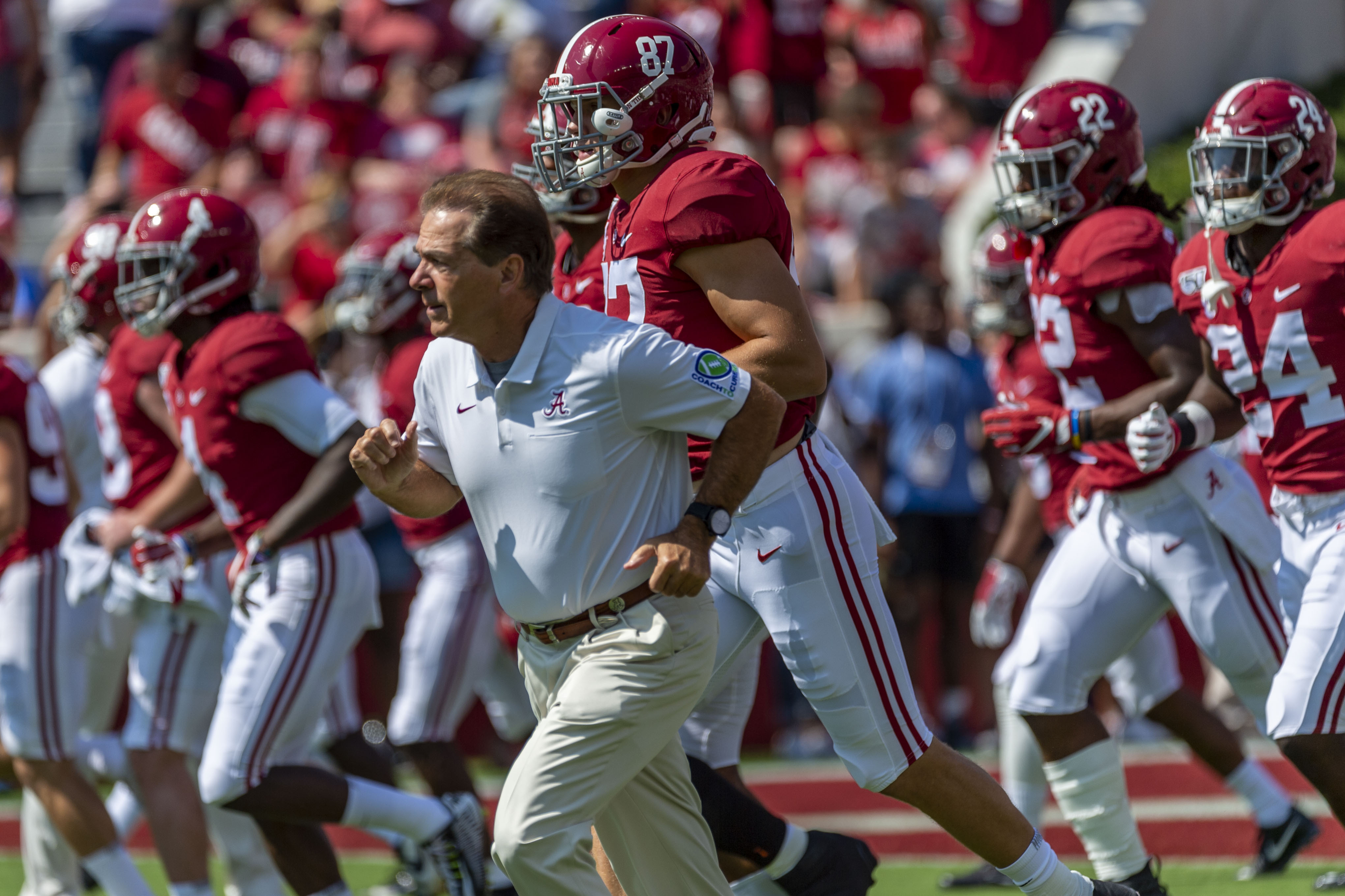 FILE - In this Sept. 28. 2019, file photo, Alabama coach Nick Saban leads the team onto the field before an NCAA college football game against Mississippi in Tuscaloosa, Ala.