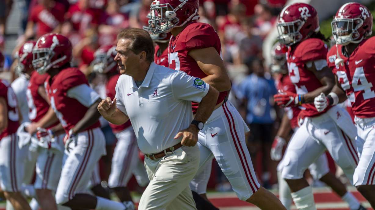 FILE - In this Sept. 28. 2019, file photo, Alabama coach Nick Saban leads the team onto the field before an NCAA college football game against Mississippi in Tuscaloosa, Ala.