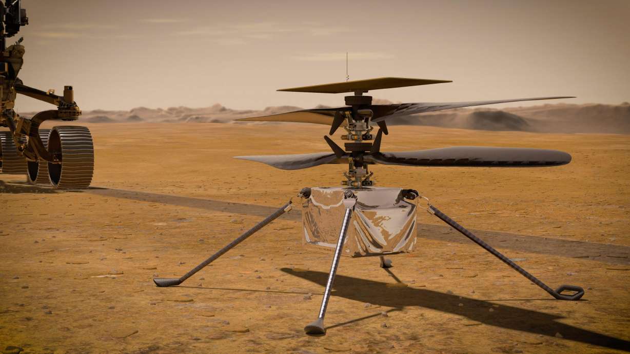 This illustration made available by NASA depicts the Ingenuity Mars Helicopter on the red planet's surface near the Perseverance rover, left. NASA is upping the ante with its newest rover headed to Mars. Set to rocket away this week from Florida, Perseverance is NASA's brawniest and brainiest Martian rover yet.