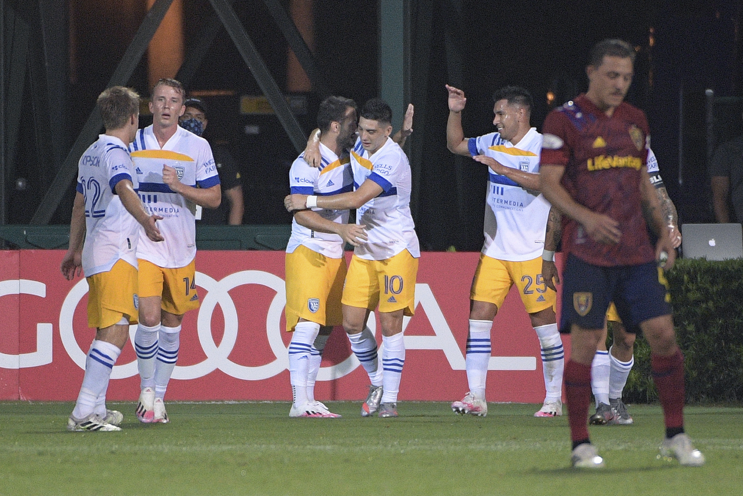 San Jose Earthquakes forward Cristian Espinoza (10) is congratulated by teammates after scoring a goal during the first half of an MLS soccer match against Real Salt Lake, Monday, July 27, 2020, in Kissimmee, Fla.