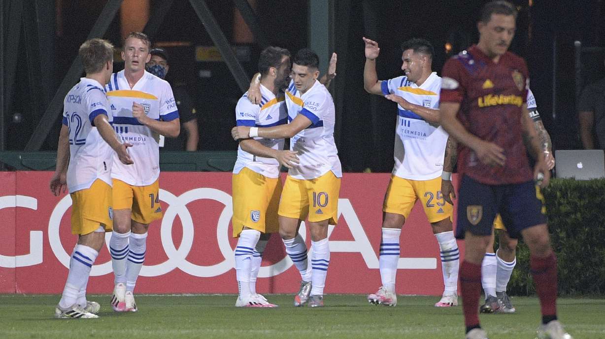San Jose Earthquakes forward Cristian Espinoza (10) is congratulated by teammates after scoring a goal during the first half of an MLS soccer match against Real Salt Lake, Monday, July 27, 2020, in Kissimmee, Fla. (AP Photo/Phelan M. Ebenhack)