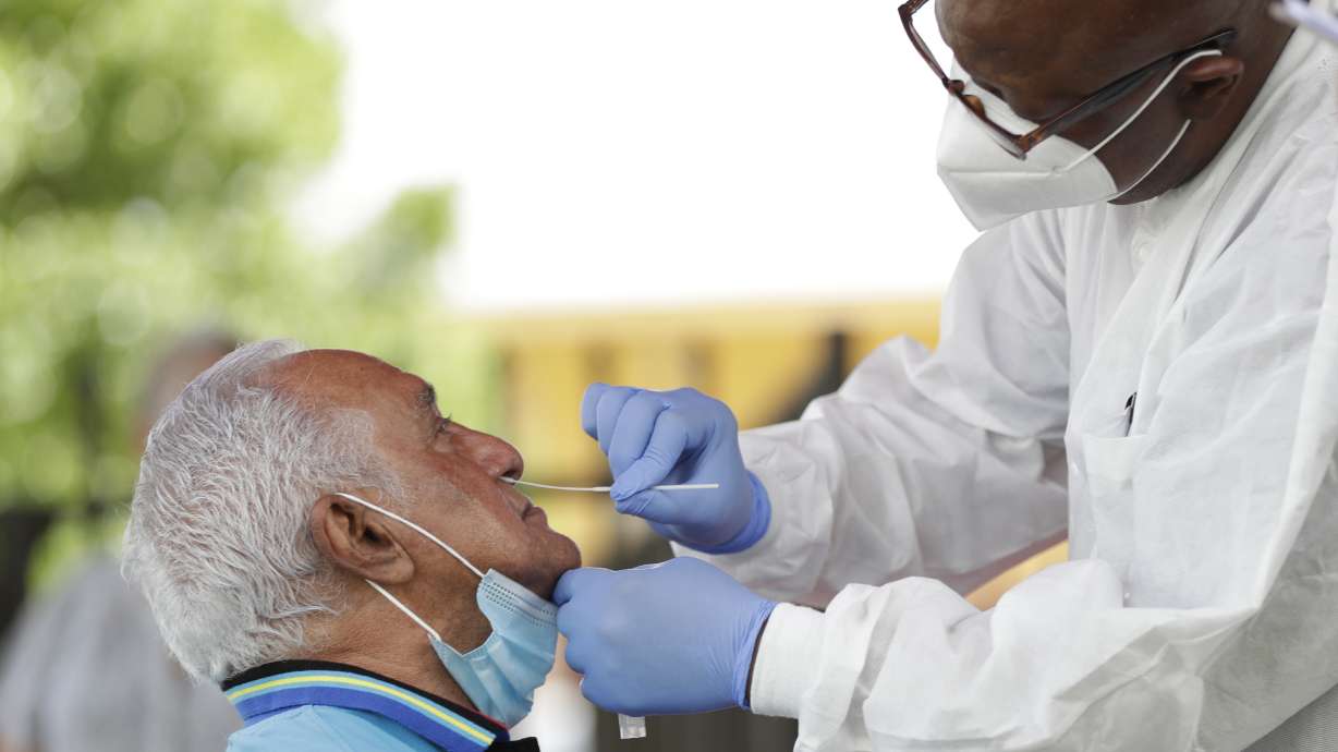 States resist mask rules as Midwest coronavirus uptick stirs alarm