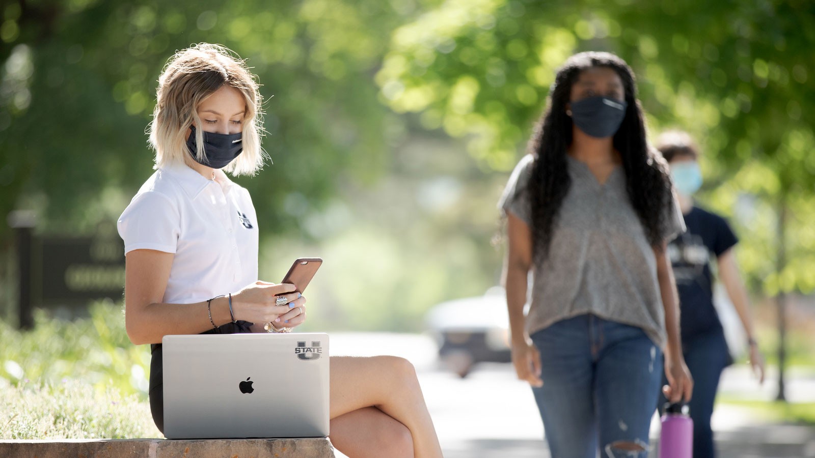 Students wear mask while on campus at Utah State University in Logan. The university will require face coverings on each of its campuses during the fall 2020 semester.