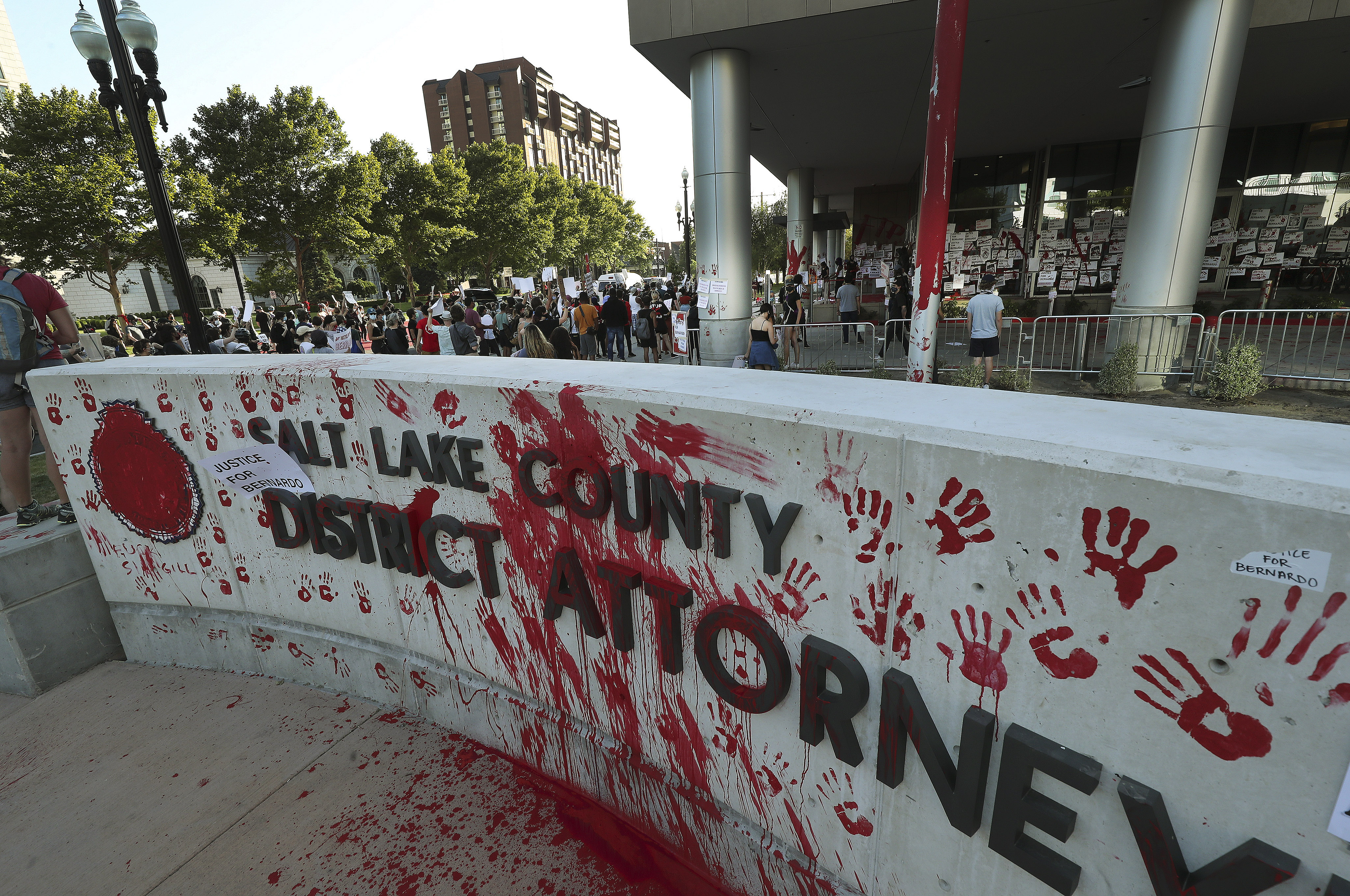 Protesters decrying the police shooting of Bernardo Palacios-Carbajal painted and marked the district attorney's office in Salt Lake City on Thursday, July 9, 2020.
