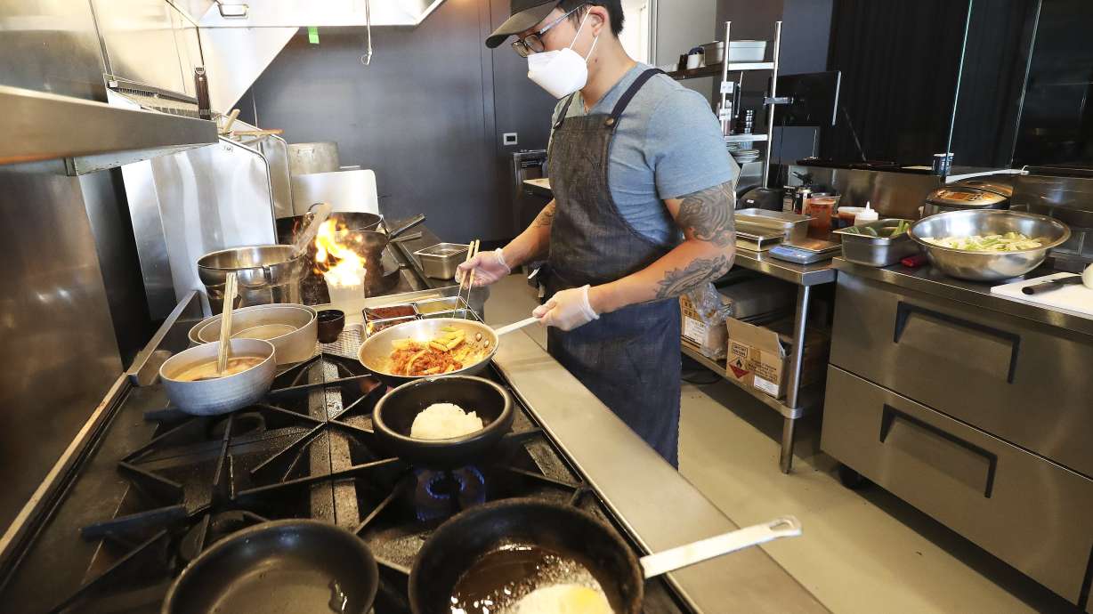 Nohm owner and chef David Chon prepares a meal for customers at the restaurant in Salt Lake City on Tuesday, July 28, 2020. Salt Lake County Mayor Jenny Wilson announced an expansion of the Small Business Impact Grant program to a variety of businesses hurt by COVID-19.