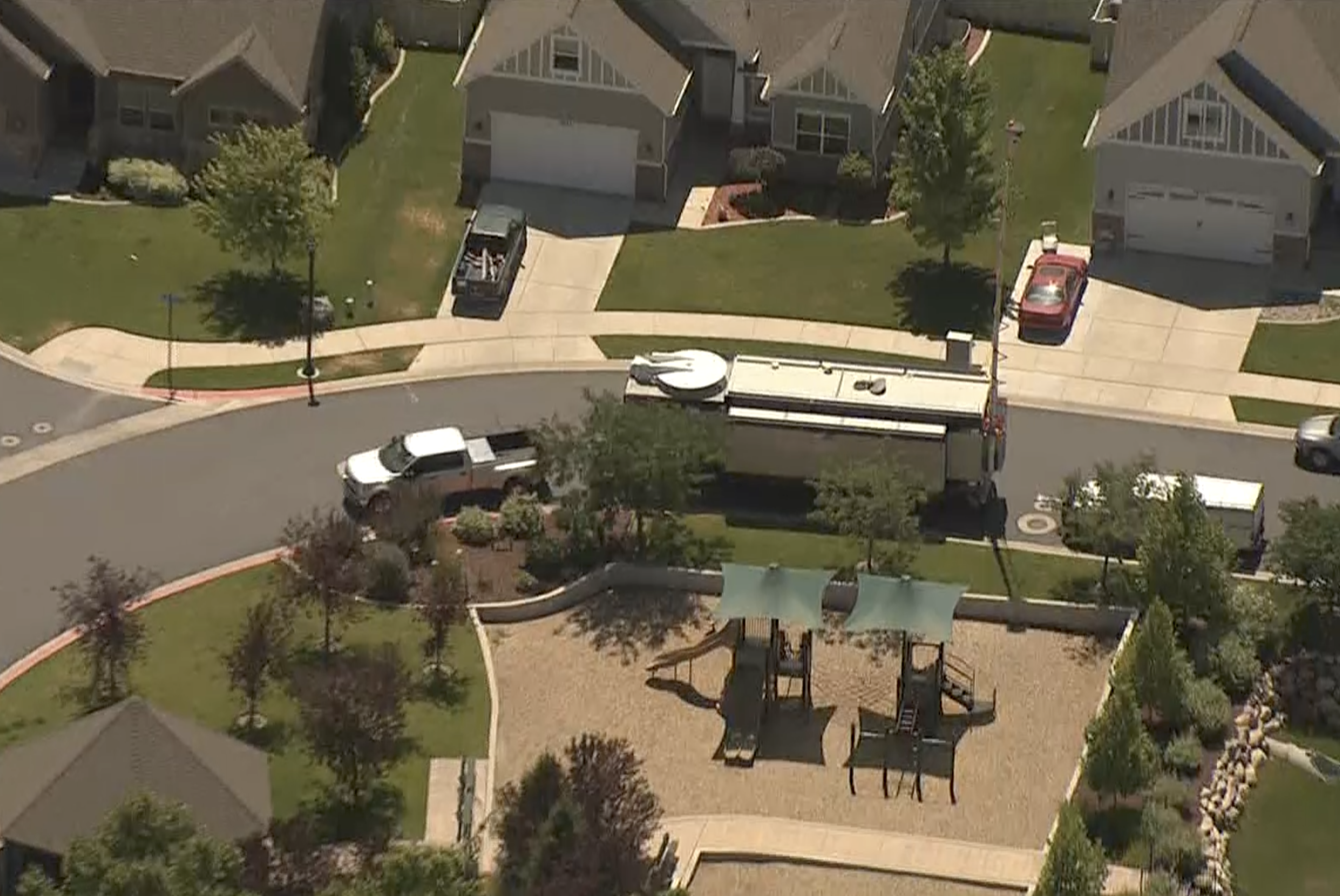 Police are seen Friday, July 24, 2020, at the scene where explosives were found in a South Jordan home after an hourslong standoff that started the night before.