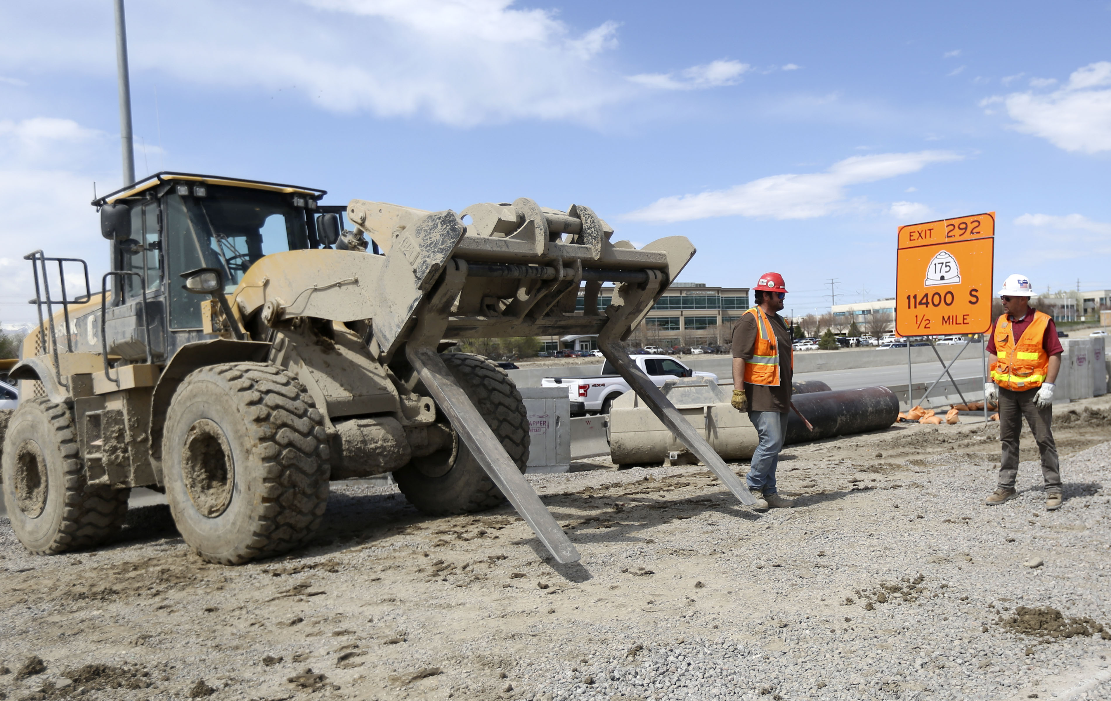Construction crews work on a new I-15 northbound travel lane, which runs from Bangerter Highway to 9400 South, in Draper on Thursday, April 9, 2020.