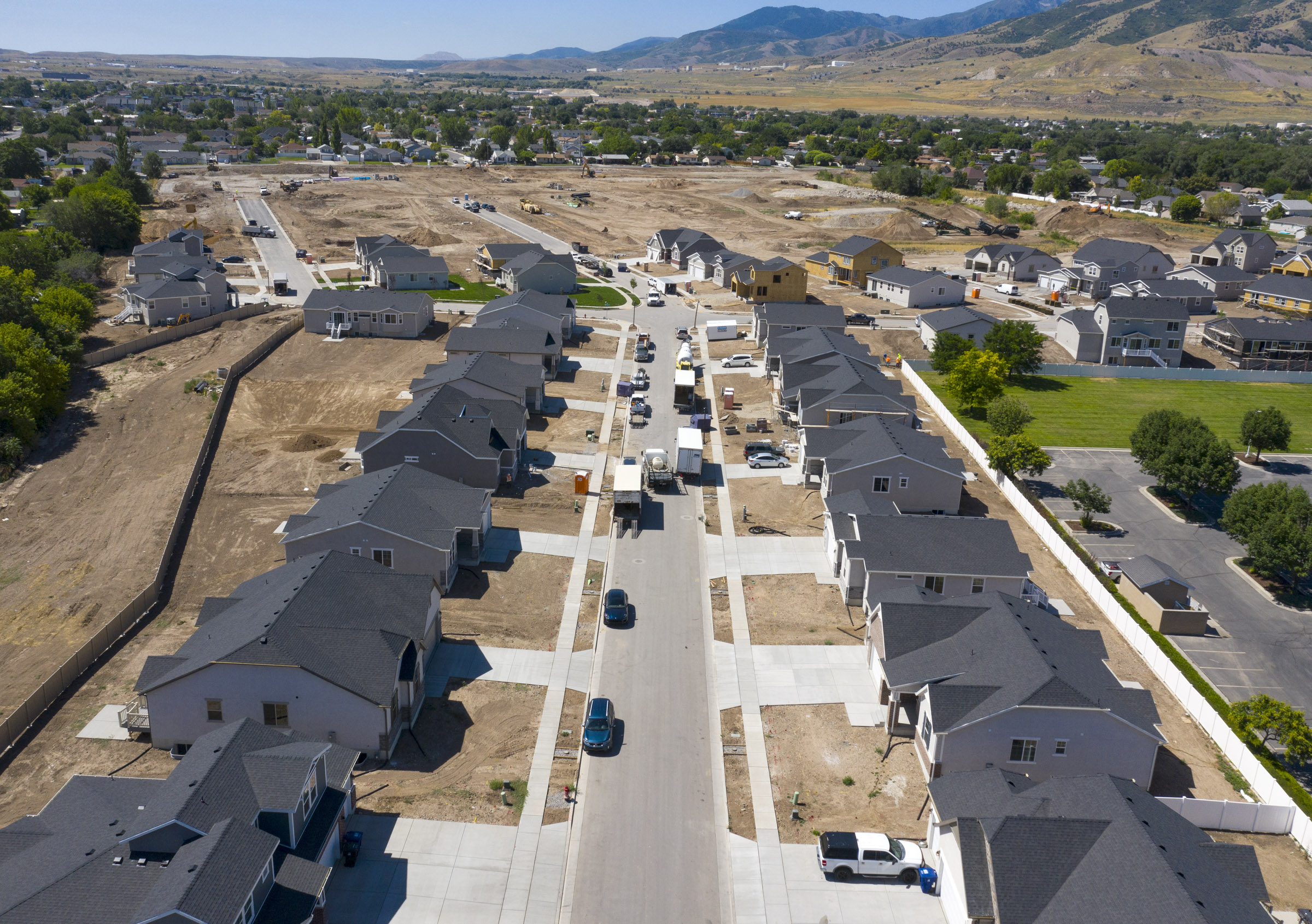 Homes near completion at C.W. Farms, an Ivory Homes development in Magna, on Wednesday, July 29, 2020. The Salt Lake City metro area is the third-most competitive housing market in the nation, according to a July ranking by Redfin, behind only Boston and San Diego. Robert Spendlove, Zions Bank senior economist, and Mike Gould, mortgage division manager for Zions Bancorporation, talked about the current state of and outlook for Utah’s housing market during a press conference at the new subdivision.
