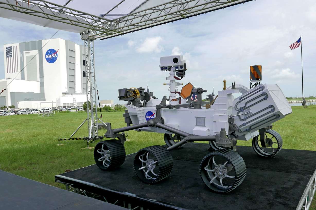 A replica of the Mars rover Perseverance is displayed outside the press site before a news conference at the Kennedy Space Center Wednesday, July 29, 2020, in Cape Canaveral, Fla. (AP Photo/John Raoux)