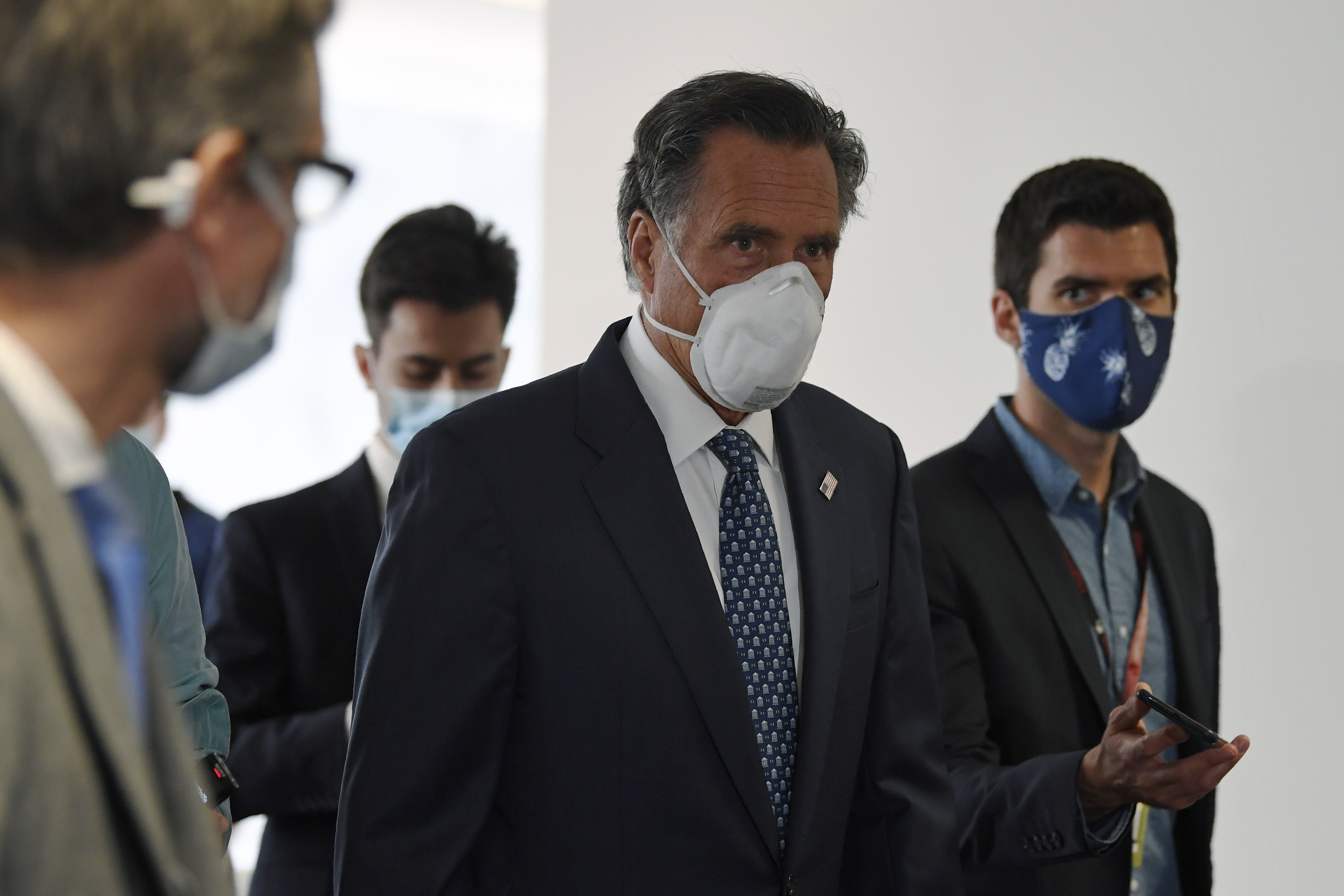 Sen. Mitt Romney, R-Utah, talks to reporters as he arrives for the weekly Republican policy luncheon on Capitol Hill in Washington, Tuesday, June 9, 2020.