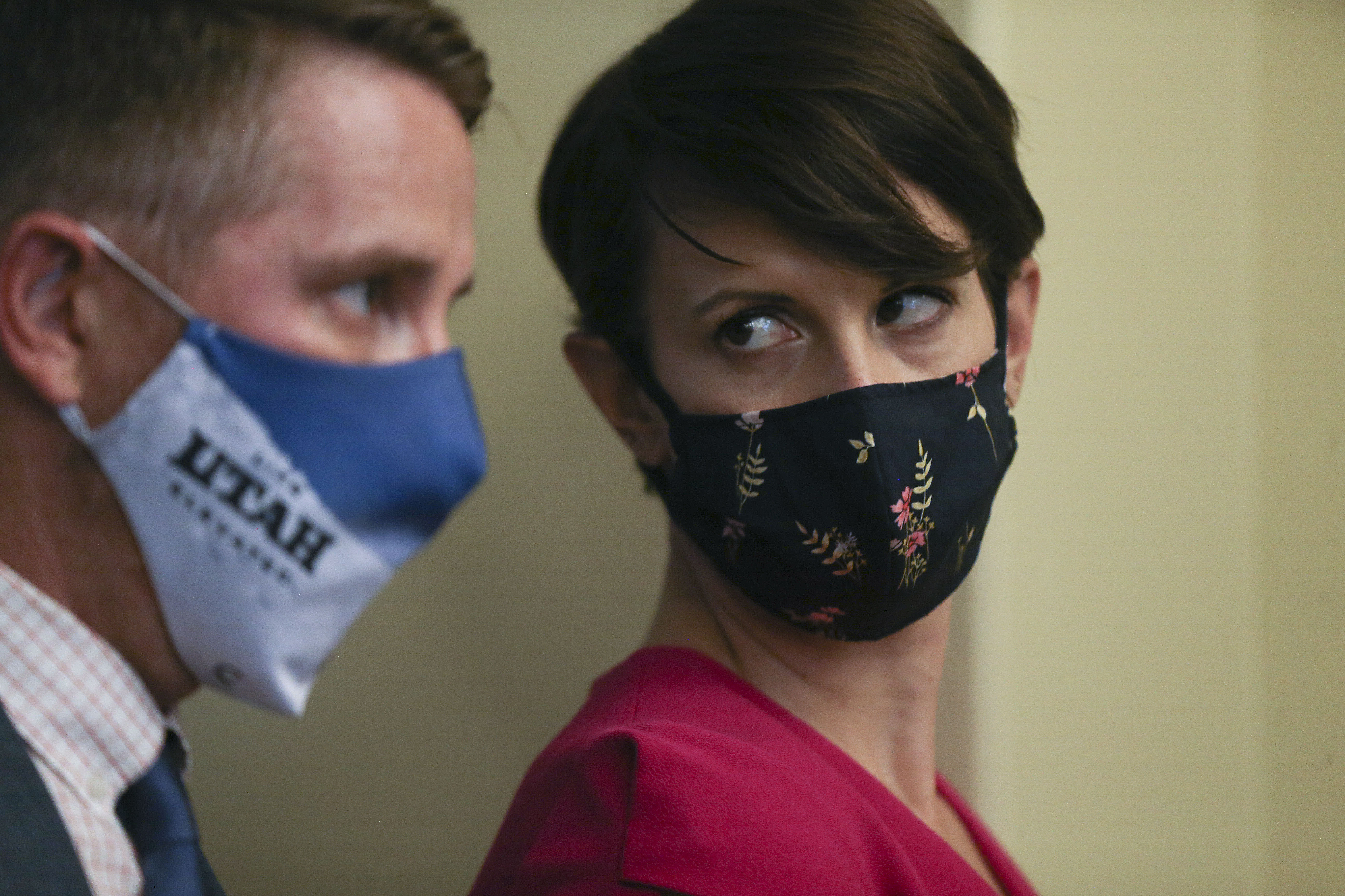 Tom Hudachko, communications director for the state health department, and Dr. Angela Dunn, state epidemiologist, confer during a COVID-19 briefing at the Capitol in Salt Lake City on Thursday, July 30, 2020.