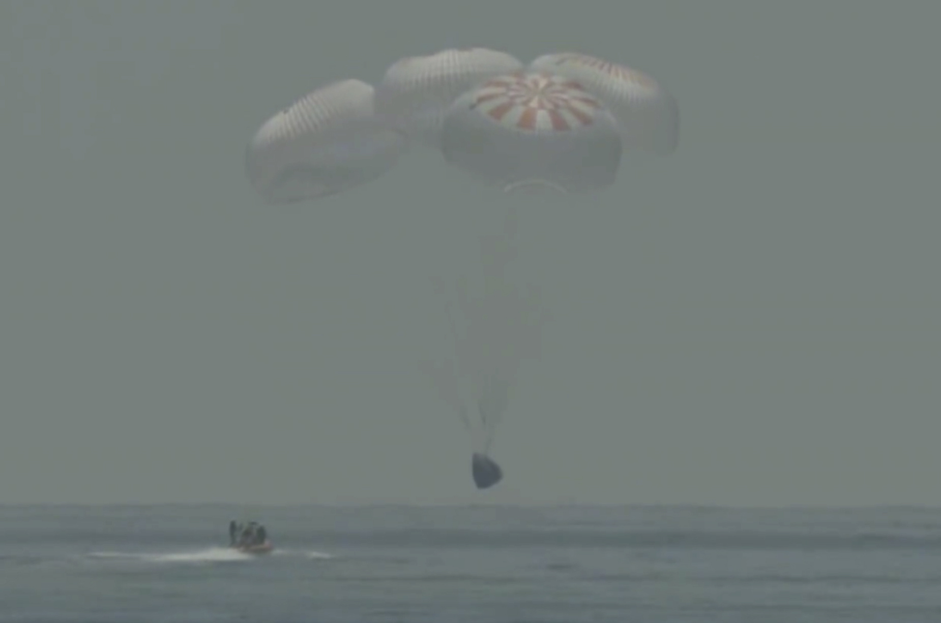In this frame grab from NASA TV, the SpaceX capsule splashes down Sunday, Aug. 2, 2020 in the Gulf of Mexico. Astronauts Doug Hurley and Bob Behnken spent a little over two months on the International Space Station. It will mark the first splashdown in 45 years for NASA astronauts and the first time a private company has ferried people from orbit.