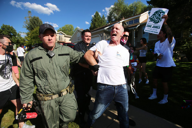 Aaron James, is taken into custody after police and marchers collided in the streets of Cottonwood Heights on Sunday, Aug. 2, 2020. The group was marching on 6710 South when police blocked them at Cristobal Street and a confrontation ensued. Police said eight or nine protesters were arrested.