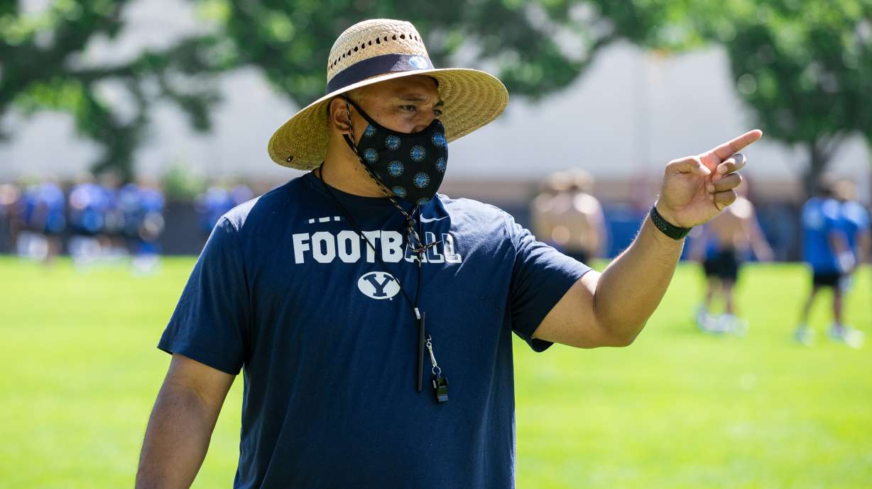 BYU football coach Kalani Sitake masks up during practice, July 27, 2020 in Provo, Utah.