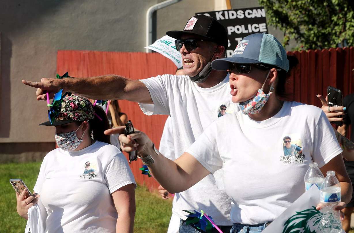 Aaron James, center, and Tiffany James, parents of Zane James, yell at police during a confrontation between police and protesters in the streets of Cottonwood Heights on Sunday, Aug. 2, 2020.