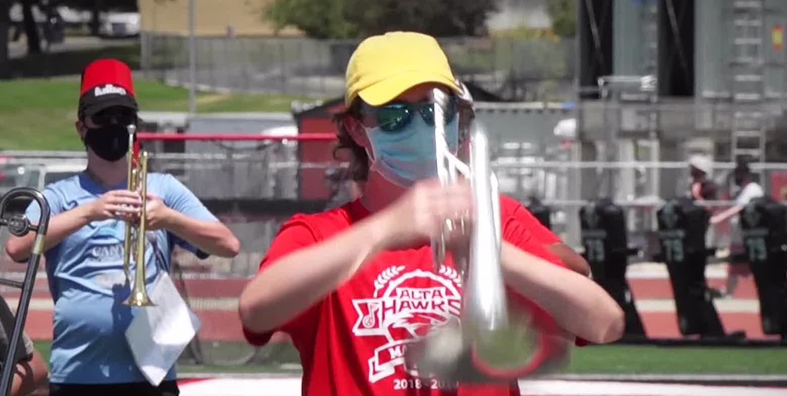 Students in marching bands will wear masks when they’re not playing instruments.