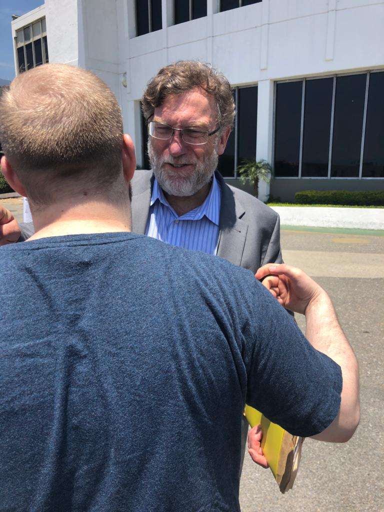 Josh Holt hugged Caleb McCarry, then a Senate staffer, at the airport in Caracas just before leaving Venezuela to fly home to the U.S.