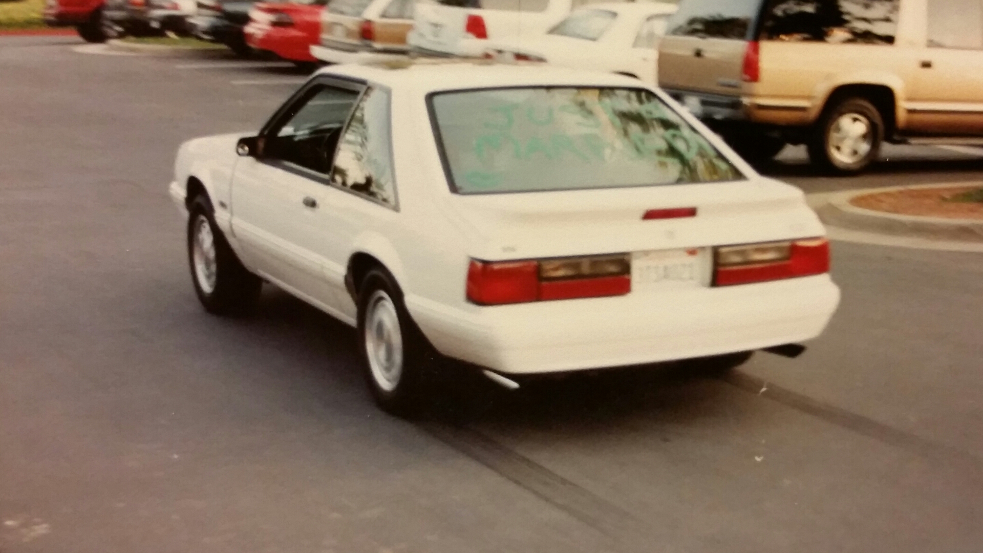 Justin Roberts does a Just Married burnout in his (and hers now) 1992 Ford Mustang. (Photo: Justin Roberts)