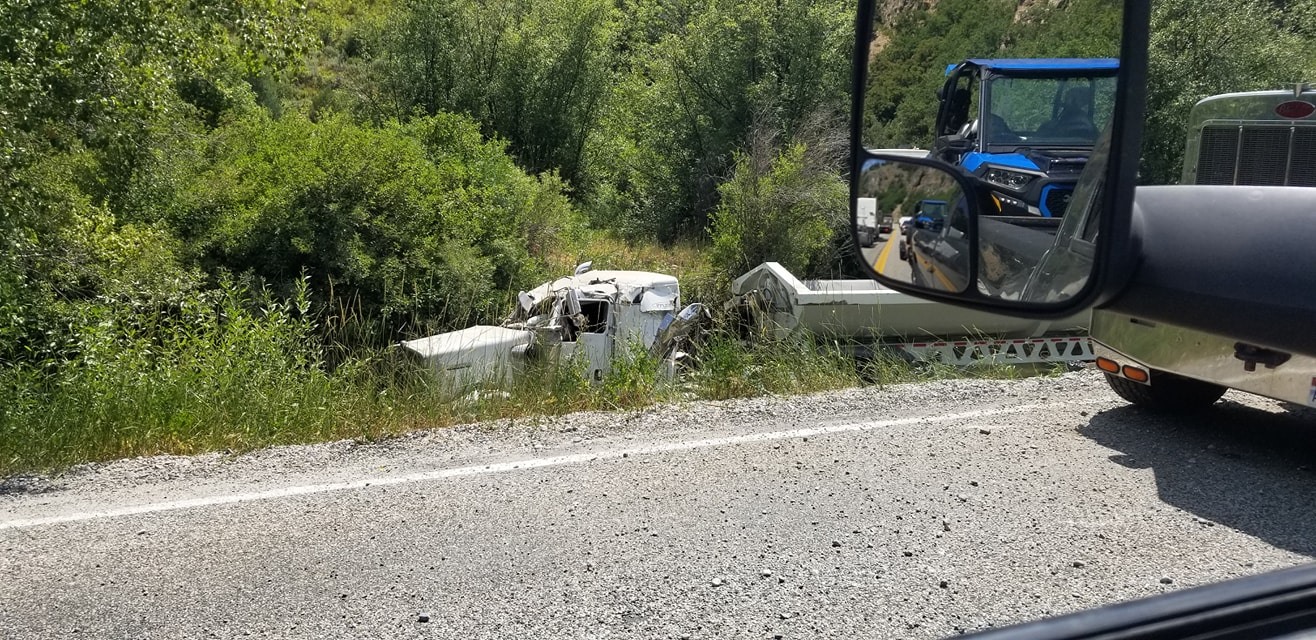 An 18-wheeler ends up in the river in Logan Canyon Wednesday, Aug. 5, 2020.