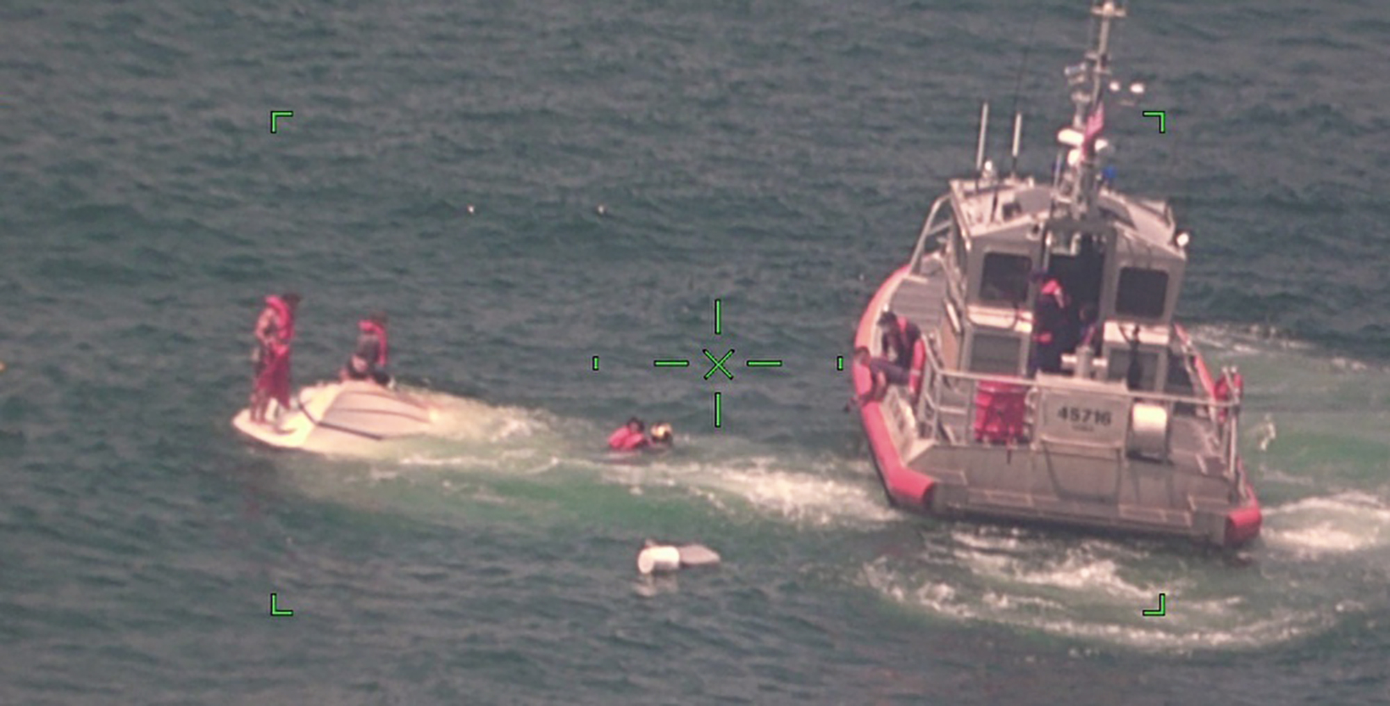 Family of 4 rescued, found clinging to overturned boat 