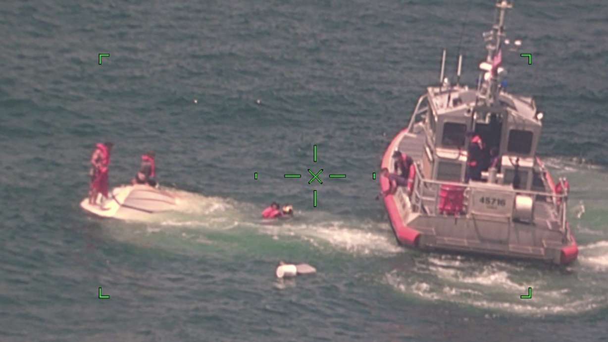 Family of 4 rescued, found clinging to overturned boat