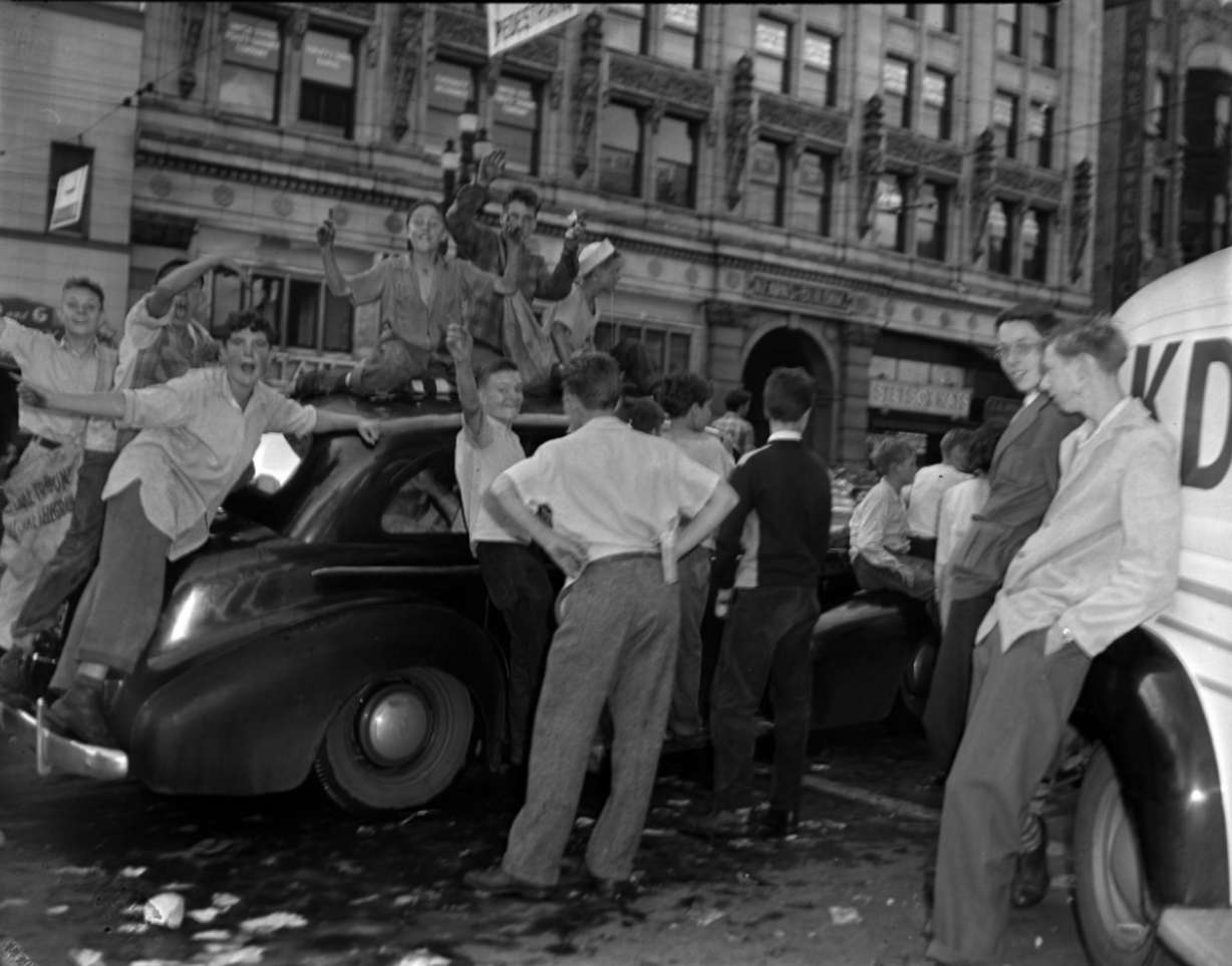 A group of boys celebrate V-J Day on Aug. 14 or Aug. 15, 1945, about a week after the U.S. attack on Nagasaki, Japan. Japan officially surrendered on Sept. 2, 1945.