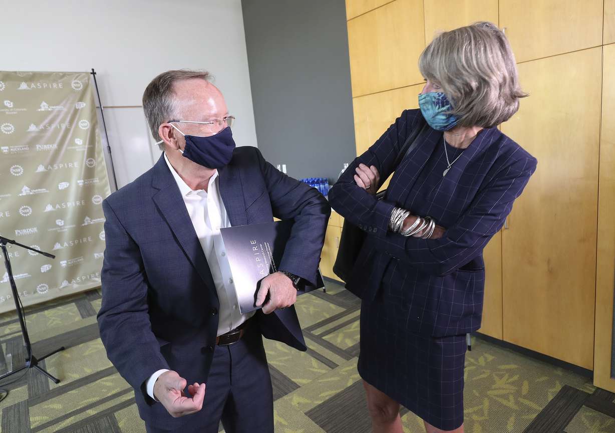 Utah Senate President Stuart Adams, R-Layton, and Utah State University President Noelle Cockett talk after a press conference at USU's Engineering Research Center for Electrified Transportation in North Logan on Thursday, Aug. 6, 2020. USU will be the lead institution for a five-year, $26 million grant to develop an international research center dedicated to advancing sustainable, electrified transportation.
