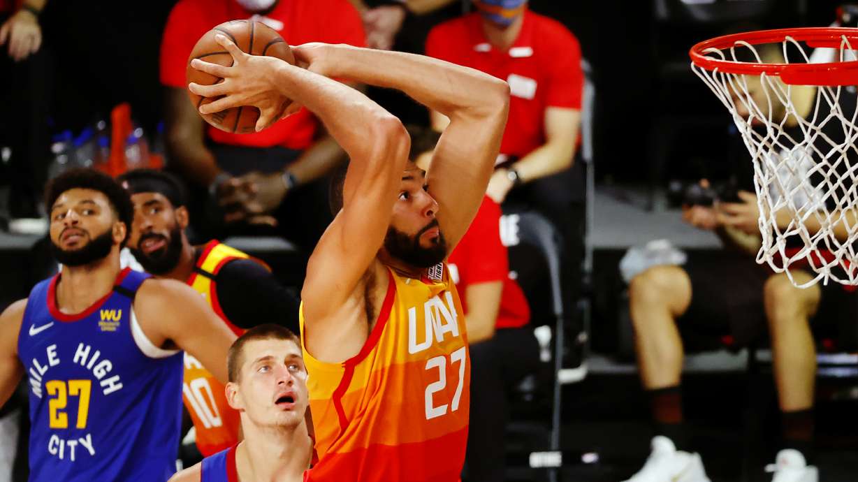 Utah Jazz' Rudy Gobert (27) dunks during the third quarter against the Denver Nuggets in an NBA basketball game Saturday, Aug. 8, 2020, in Lake Buena Vista, Fla.