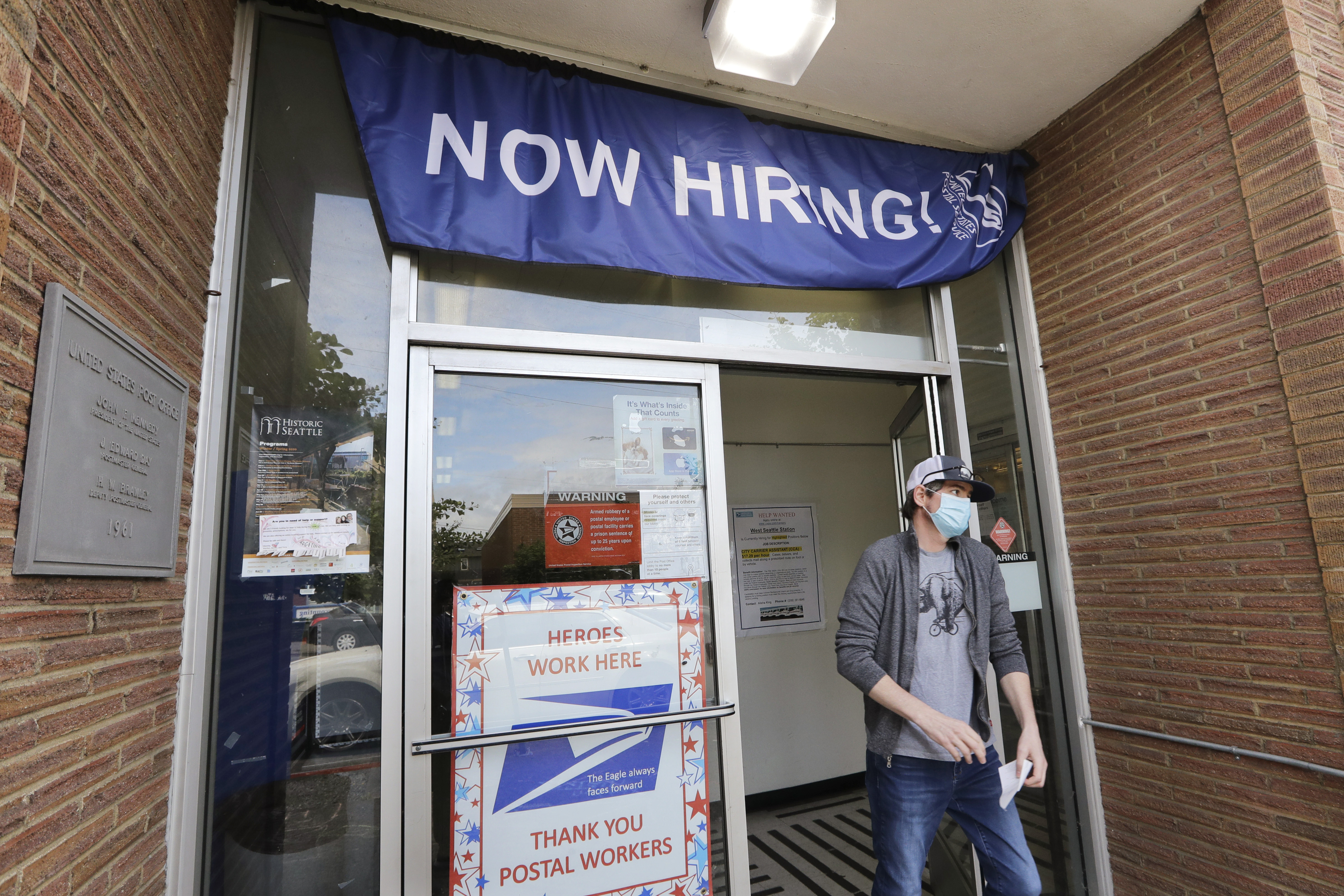 US employers post more jobs in June, pull back on hiring