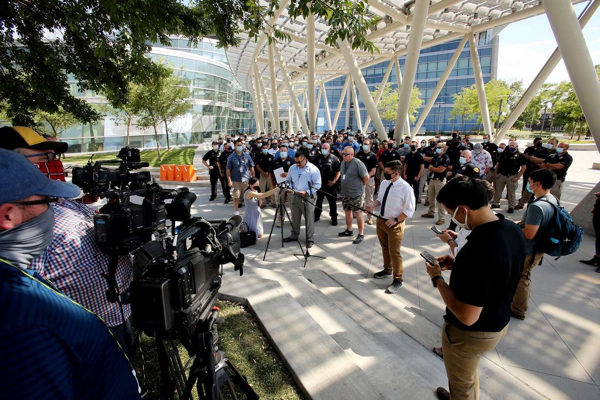 Salt Lake police officer Jon Fitisemanu reads a statement from the Salt Lake Police Association rejecting Mayor Erin Mendenhall’s claim of racial and social disparities across all Salt Lake City agencies and institutions during a press conference at the Public Safety Building on Monday, Aug. 10, 2020.