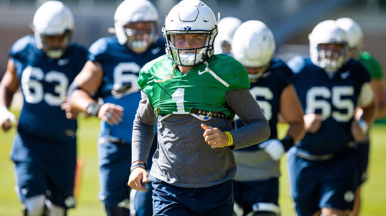 BYU quarterback Zach Wilson leads the team into practice, Monday, Aug. 10, 2020 in Provo. (Photo: Jaren Wilkey, BYU Photo)