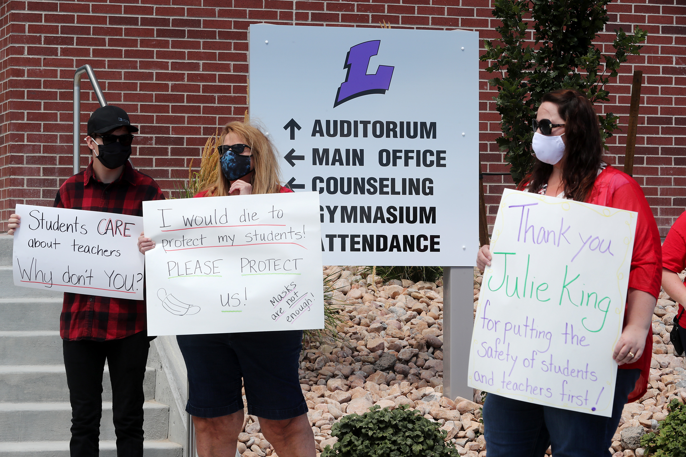 A small group of parents, teachers and students gather at Lehi High School in Utah County to persuade Alpine board of education members to adopt clear metrics to guide learning modalities in their Return to Learn plan on Tuesday, Aug. 11, 2020.