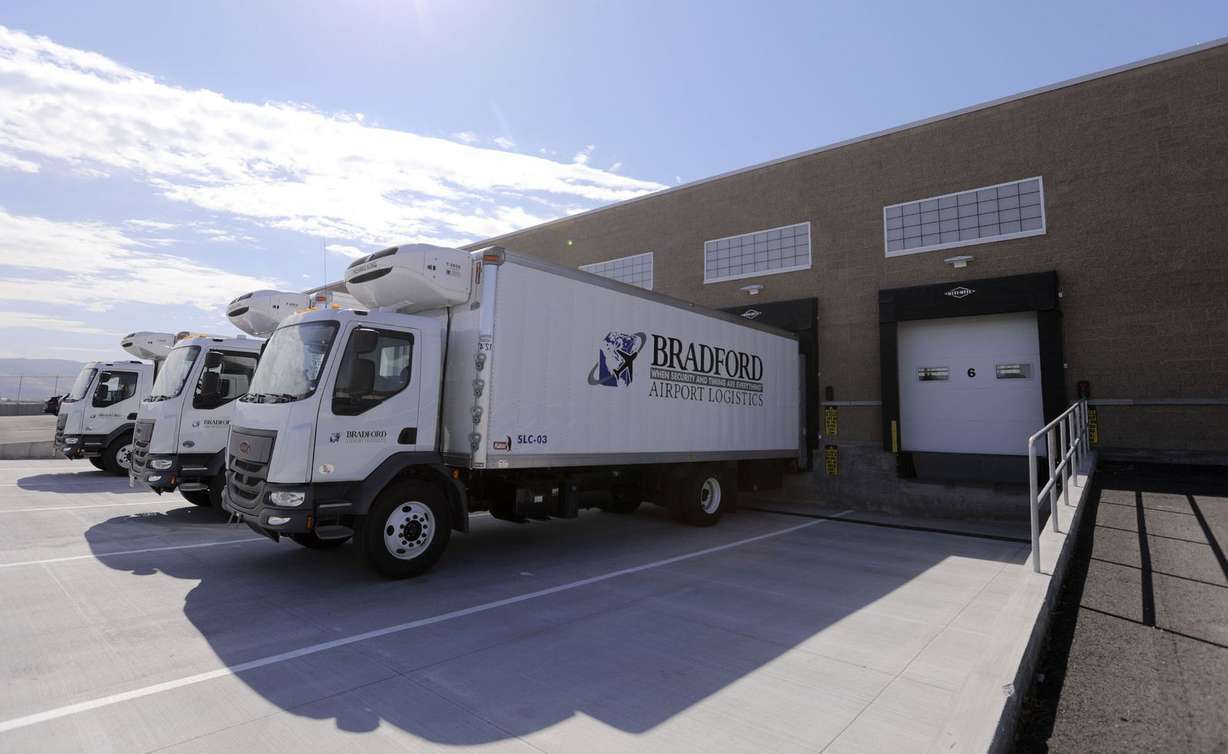 Trucks are lined up outside of Salt Lake City International Airport’s new Central Receiving and Distribution Center during its grand opening ceremony in Salt Lake City on Tuesday, Aug. 11, 2020.