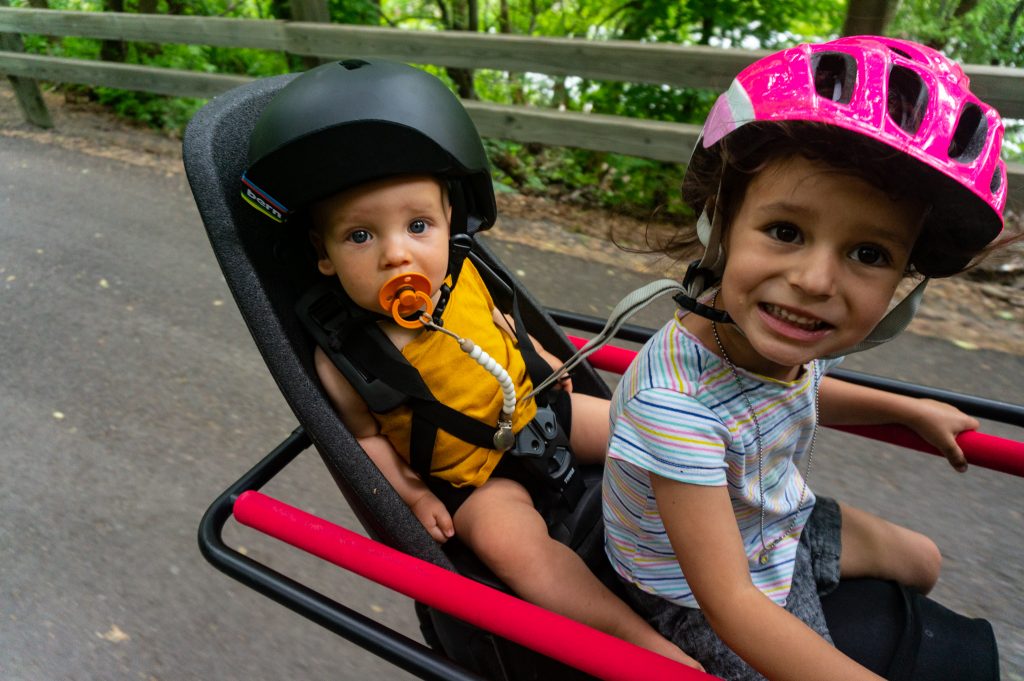 Chris and Teya Wiltsie’s kids love to ride in tow with their mom and dad.