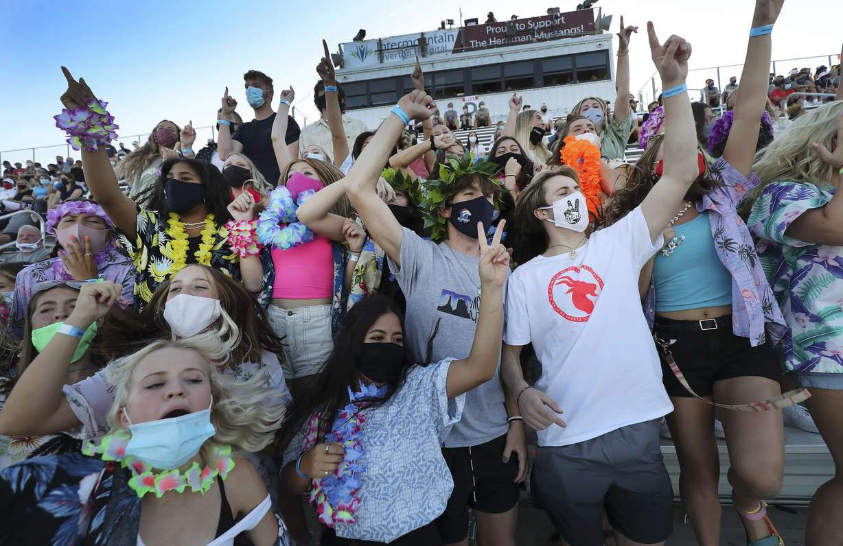 Herriman students cheer as the school's football team plays Davis in Herriman on Thursday, Aug. 13, 2020. The game is the first U.S. high school football game since the pandemic began.