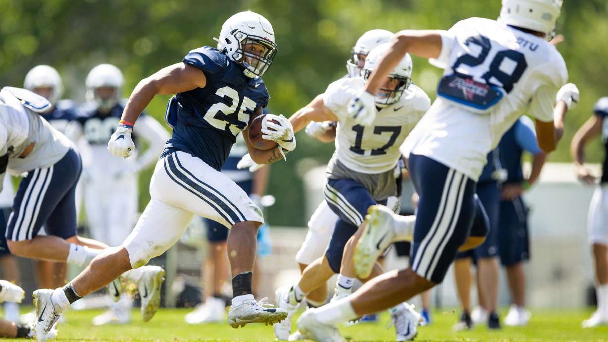 BYU running back Tyler Allgeier runs the ball during fall training camp, Friday, Aug. 14, 2020 in Provo.
