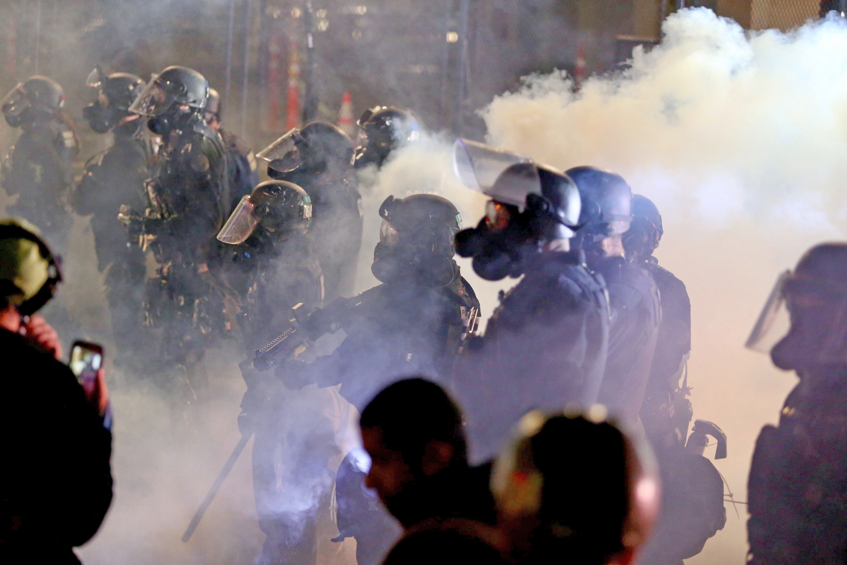 Protesters skirmish, fire pepper spray in Portland 