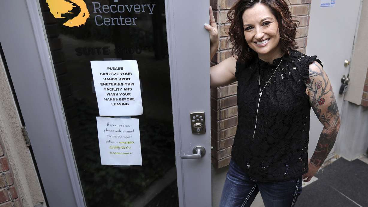 Amy Daeschel, Steps Recovery Center marketing business development manager, poses for a portrait outside of Steps Recovery Center in Murray on Wednesday, July 22, 2020. Daeschel says shee was saved by naloxone after an opioid overdose and has since saved two others with naloxone.