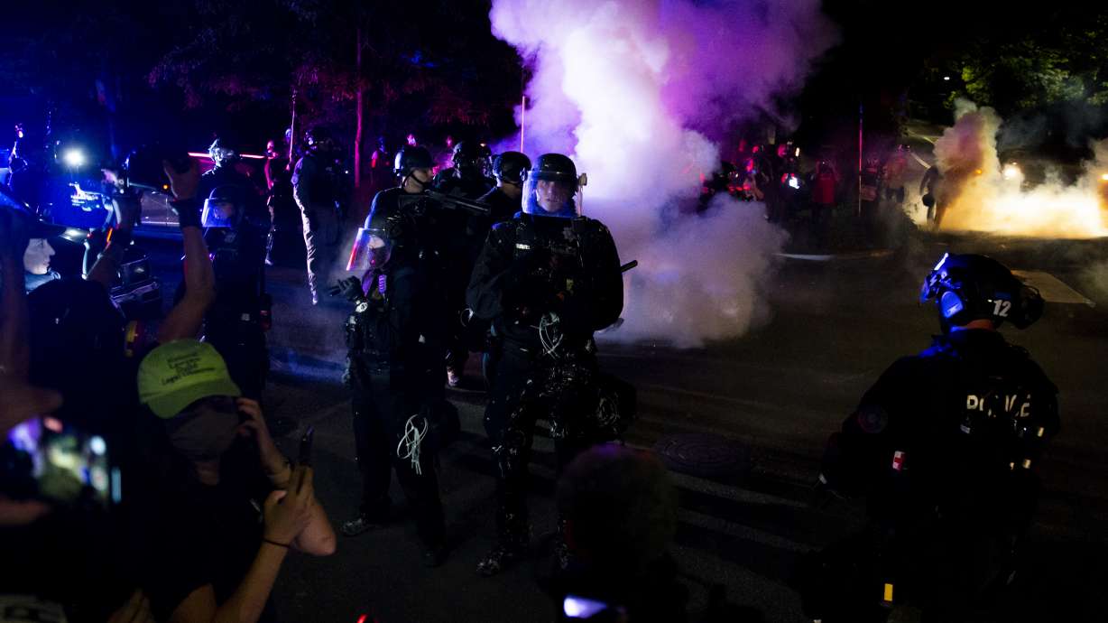 Portland police declare riot, use smoke to clear crowd