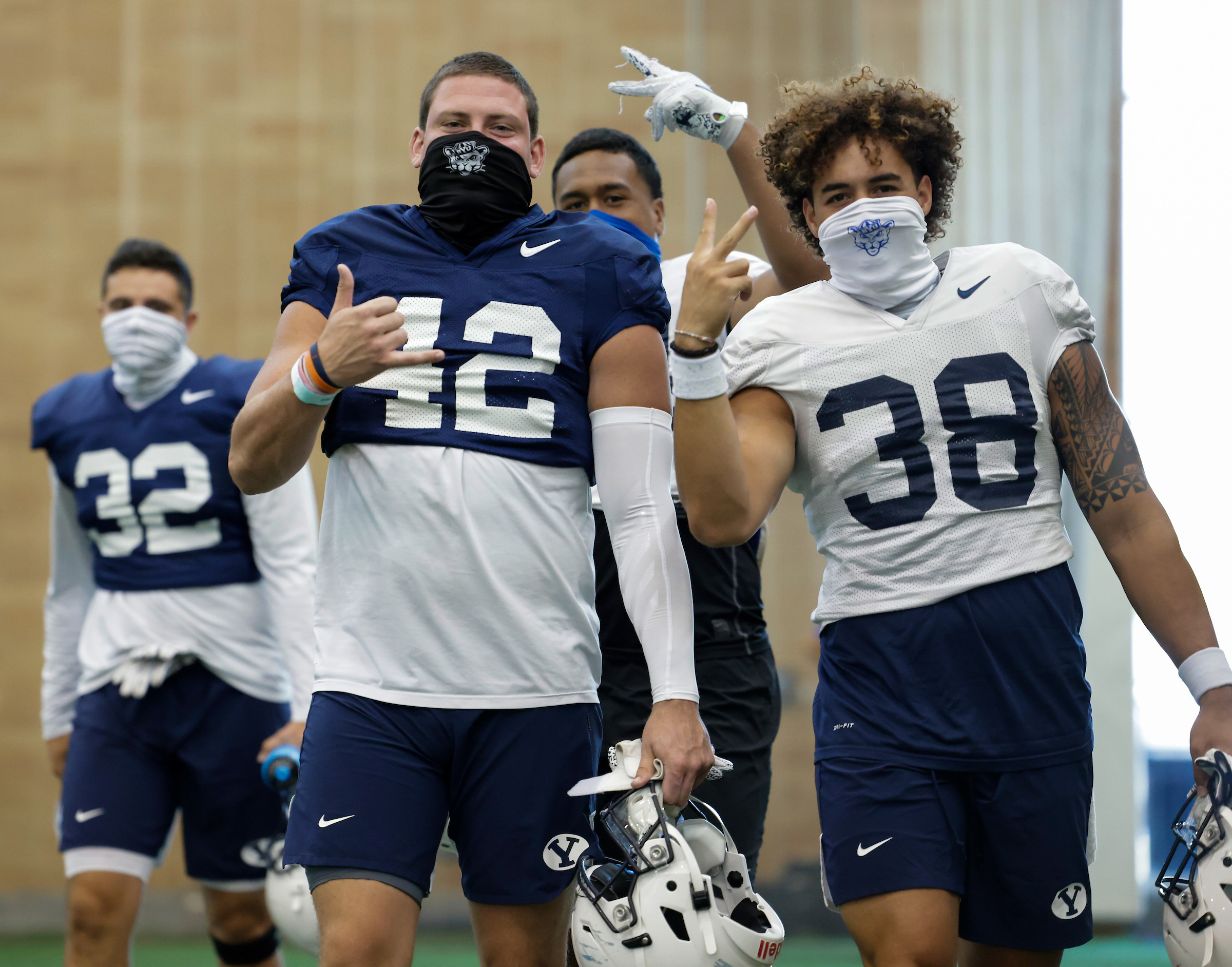 BYU tight end Kyle Griffits, left, and linebacker Jackson Kaufusi during training camp, Tuesday, Aug. 18, 2020 in the indoor practice facility in Provo.