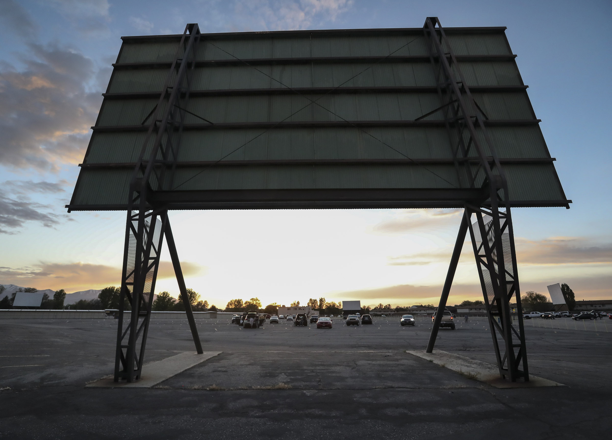Moviegoers are parked with two spaces between each vehicle asÂ Redwood Drive-In Theatre opens for business in West Valley City on Friday, May 1, 2020. The drive-in was closed because of the COVID-19 pandemic.