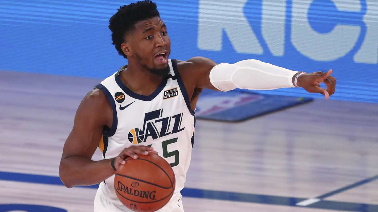 Utah Jazz guard Donovan Mitchell dribbles the basketball against the Denver Nuggets in Game 2 of an NBA basketball first-round playoff series, Wednesday, Aug. 19, 2020, in Lake Buena Vista, Fla.