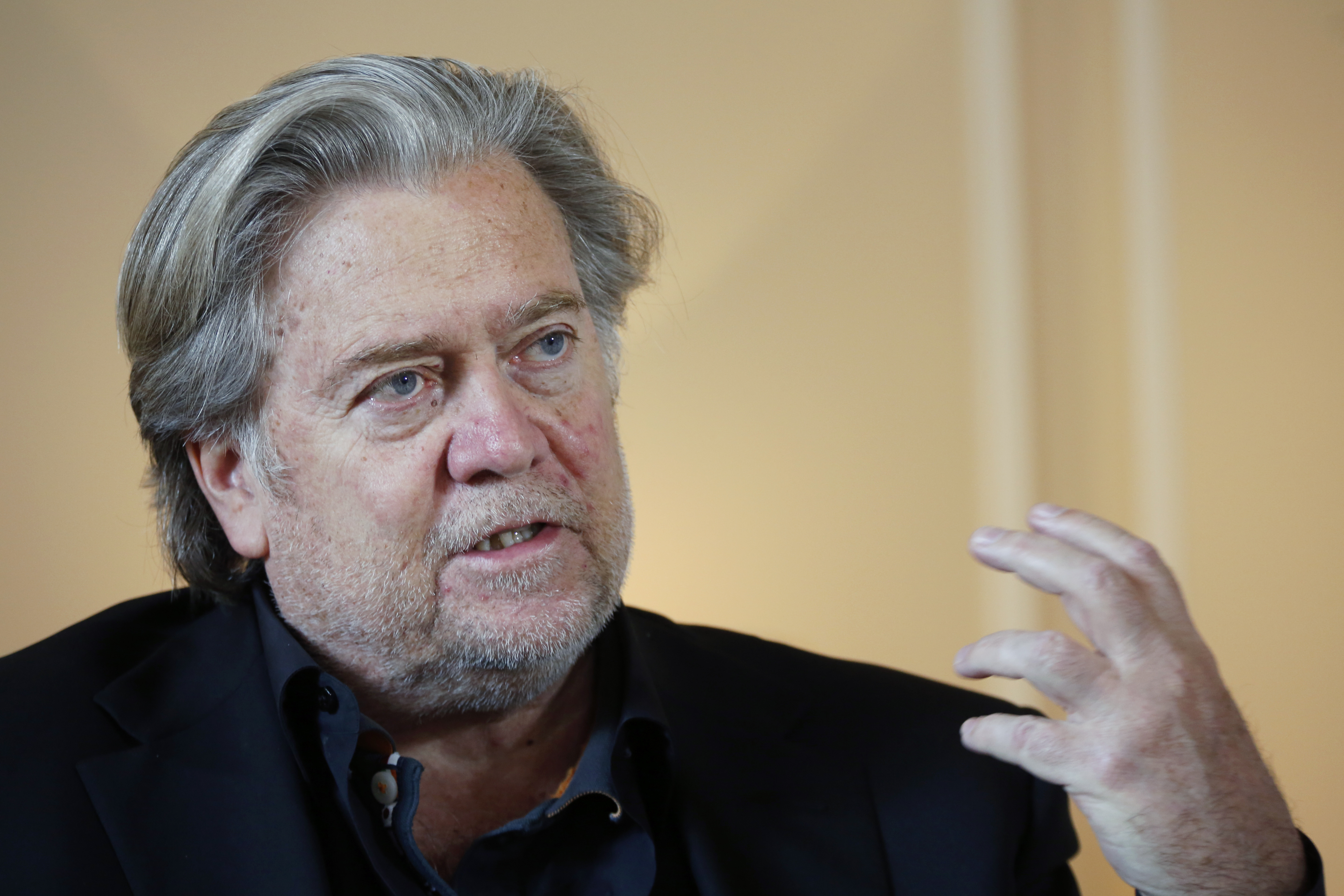 FILE - In this May 27, 2019 file photo, former White House strategist Steve Bannon pauses prior to an interview in Paris. Bannon was arrested Thursday, Aug. 20, 2020, on charges that he and three others ripped off donors to an online fundraising scheme “We Build The Wall.” The charges were contained in an indictment unsealed in Manhattan federal court. (AP Photo/Thibault Camus, File) [Aug-20-2020]