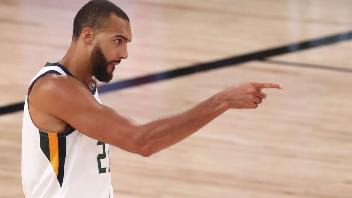 Utah Jazz center Rudy Gobert (27) celebrates after being fouled while making a basket against the Denver Nuggets in Game 2 of an NBA basketball first-round playoff series, Wednesday, Aug. 19, 2020, in Lake Buena Vista, Fla.