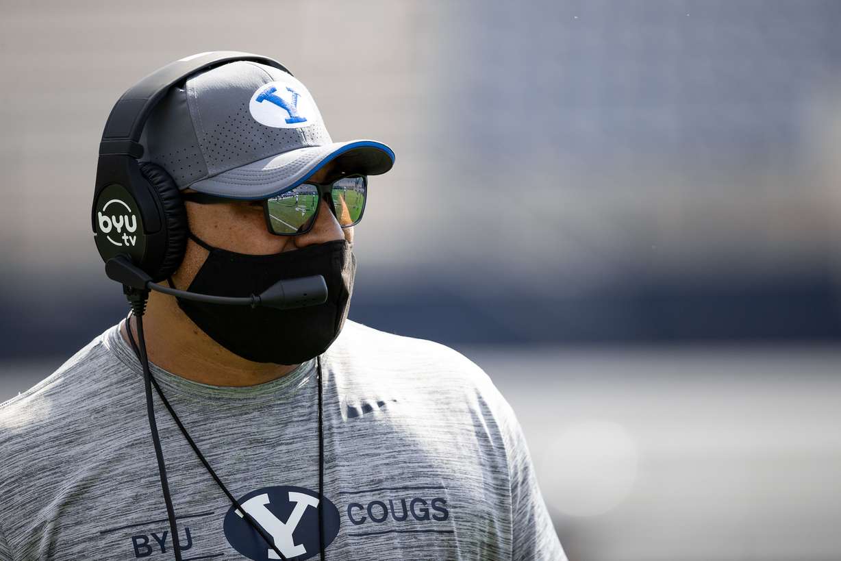 BYU coach Kalani Sitake wears a mask during a scrimmage at LaVell Edwards Stadium wearing masks, Thursday, Aug. 20, 2020 in Provo.